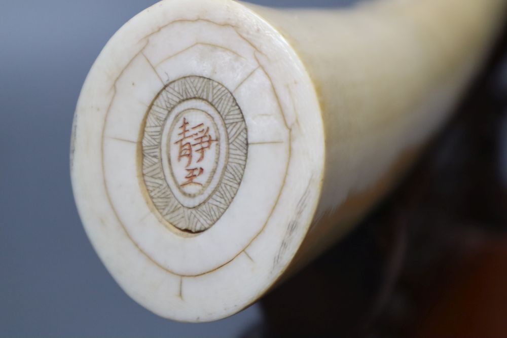 A Japanese ivory Seven immortals tusk carving, early 20th century, wood stand, signed, 44cm excl. stand